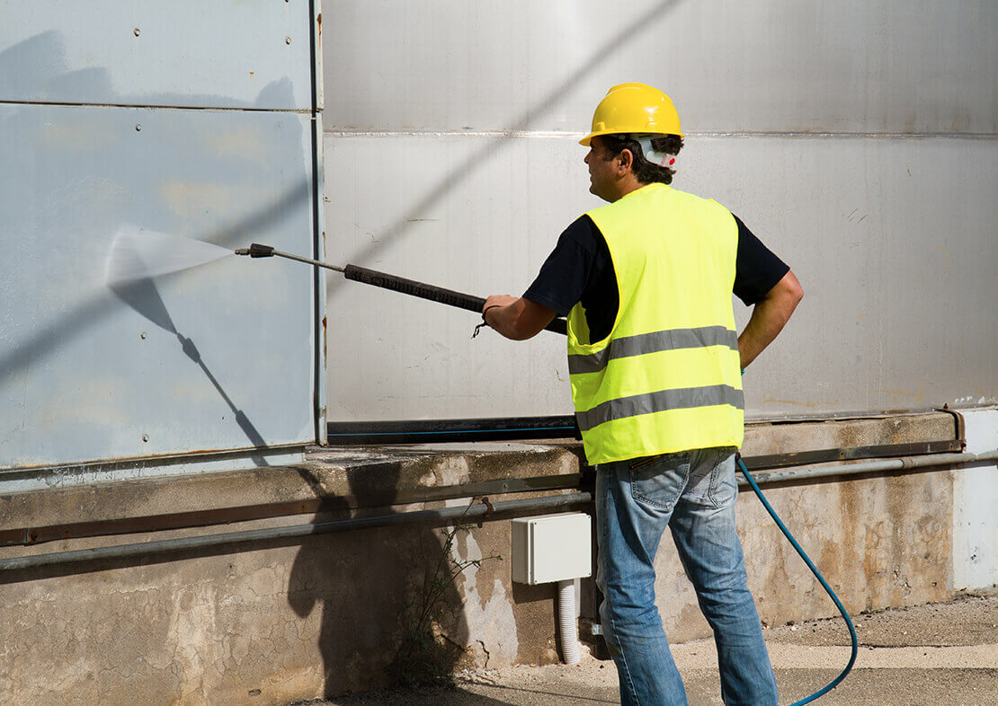 Man Cleaning A Wall